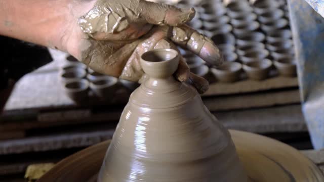 20 September 2023, Pune, India, Indian potter making Diya (oil lamps) or earthen lamps for Diwali Festival with clay, Artistic beautiful clay lamp made by potter, Handwork craft.