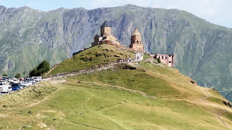 Gergeti Trinity Church with view of  Caucasus mountains