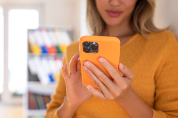 istock Woman using the mobile phone 1695756261
