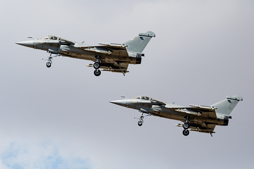 Military fighter jet plane at air base. Airport and airfield. Air force flight operation. Aviation and aircraft. Air defense. Military industry. Fly and flying. Dogfight and afterburner.