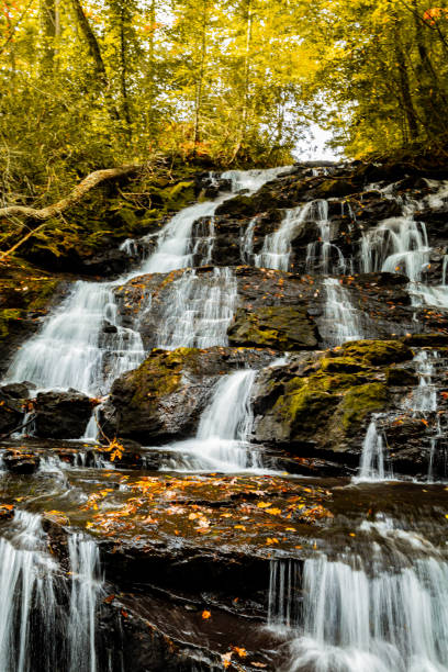 istock Beautiful waterfall cascading in scenic autumn or Fall setting at Vogel State Park in Georgia 1695766052