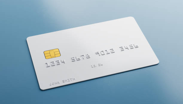 istock A blank white credit card with fake number and name lying on a blue table 1695768740