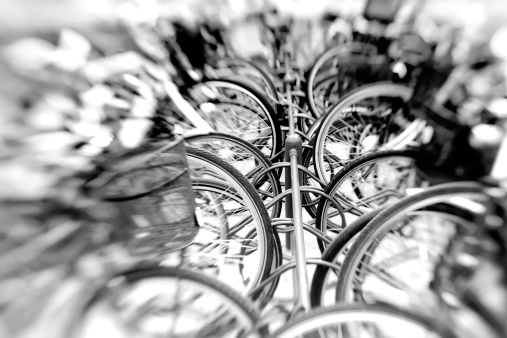 A lens blurred photo of a group of bikes