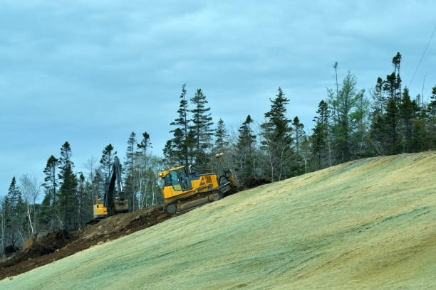 Grading and Hydroseeding a Bank in Summer