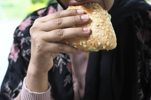 istock women mouth eating a sandwich 1695793503