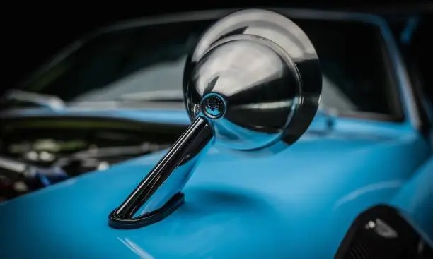 Blue car showing the chrome mirror