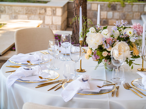 Luxury elegant wedding reception table arrangement and floral centerpiece - wedding banquet and event outdoor