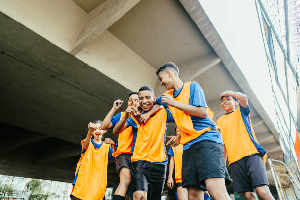 Soccer players celebrating on the soccer field Soccer players celebrating on the soccer field club soccer photos stock pictures, royalty-free photos & images