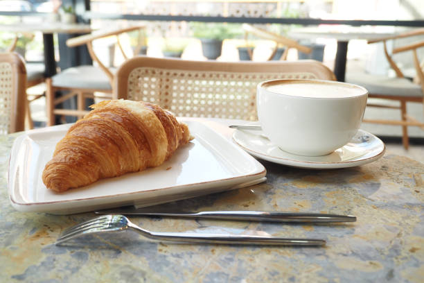 istock A breakfast plate with croissant and coffee on table 1695814895