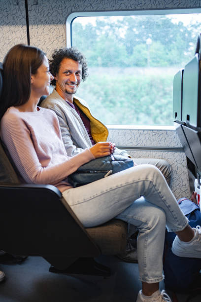 istock Couple travelling together by train 1695858618