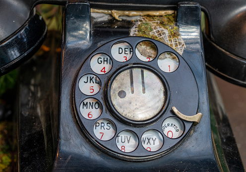 Close up of an old dial telephone