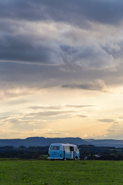 campervan german volkswagen at sundown landscape evening stock photo