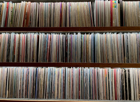 Collection of vintage vinyl records in music studio.