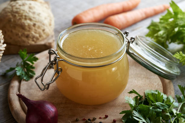 istock Bone broth made from chicken in a glass jar 1695898847