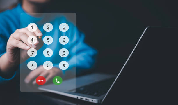 istock Dialing on virtual telephone keypad with transparent telephone buttons, businessman touch button of telephone number on screen, Finger touch number on smartphone to make a call, close up 1695901507
