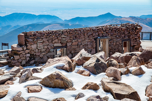Old stone wall of building at Pikes Peak summit of (elevation 14115 feet) in the Rocky Mountains in central Colorado in western USA of North America. Nearby cities are Colorado Springs, Denver and Pueblo, Colorado.