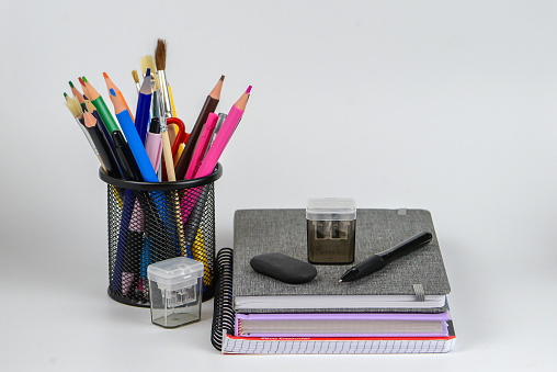 pink pencil with sharpener on light pink background