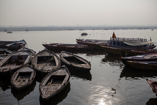 Boats on the Ganges River in Varanasi, India at sunset