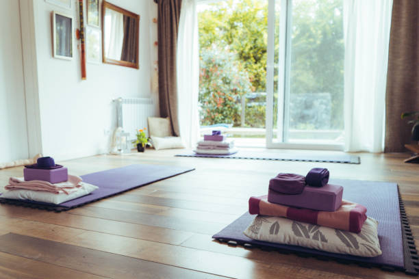 istock Cute yoga studio with mats on the floor. 1696024082