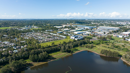 Drone aerial photograph of industrial buildings and houses near the International Regatta Centre in Penrith, New South Wales, Australia.