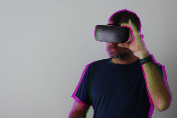 istock Man wearing vr glasses 1696060330
