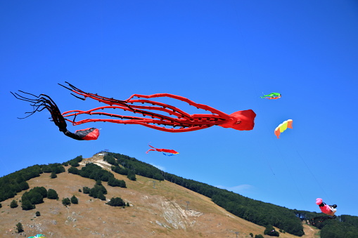 Roccaraso Aremogna, Abruzzo. Brightly colored kites of different sizes and shapes competing on the Aremogna plateau.