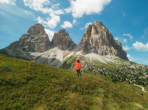 Aerial view of woman hiking in Dolomites  in summer