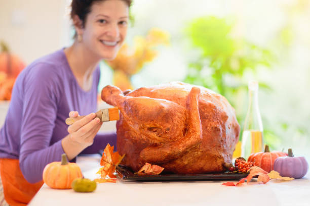 istock Family cooking Thanksgiving dinner 1696086565