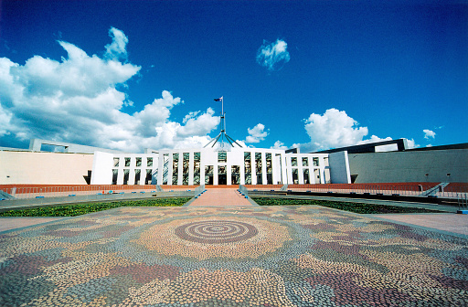 Canberra, ACT, Australia: New Parliament House - Parliament House is the seat of Australia's legislature in Canberra. Sessions of the Senate and the House of Representatives take place there. Opened in 1988, the building is located in the city center on Capital Hill and forms the southern tip of the Parliamentary Triangle. Designed by the Italian architect Romaldo Giurgola.