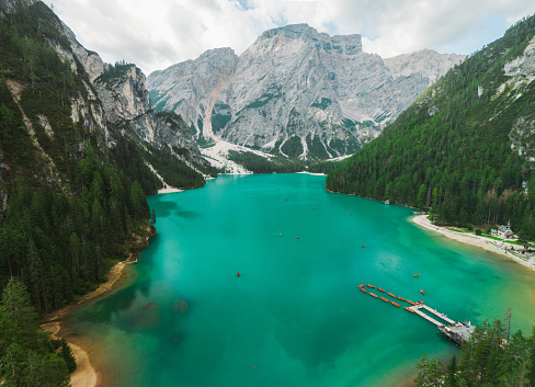 Scenic aerial view of boats on lago di Braies in Dolomites