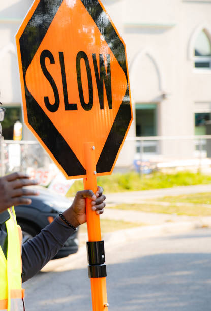 istock Traffic control with stop slow sign according to construction plan 1696219805