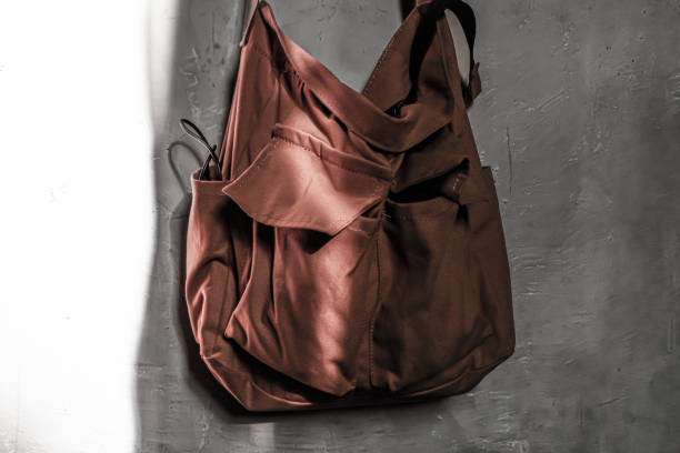 a sling bag hanging on the wall.
