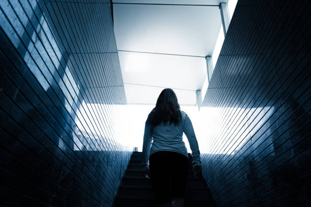 istock Women walking up in tunnel 1696325419