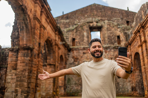 Tourist taking selfie in the ruins of São Miguel das Missões Cathedral