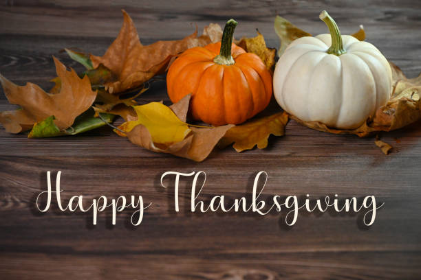 istock Pumpkins and leaves. Happy Thanksgiving. 1696383261