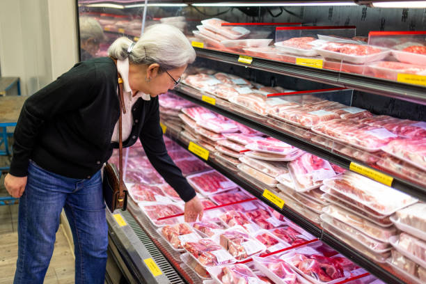 istock Senior Shopping at Grocery Store 1696426616