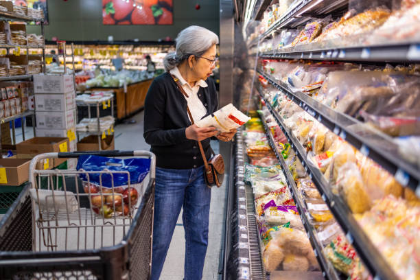 istock Senior Shopping at Grocery Store 1696426627