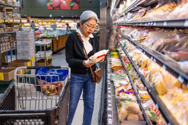 istock Senior Shopping at Grocery Store 1696426628