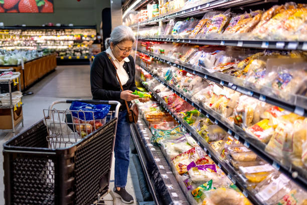 istock Senior Shopping at Grocery Store 1696426634