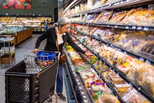 istock Senior Shopping at Grocery Store 1696426636