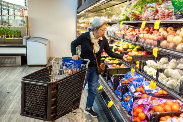 istock Senior Shopping at Grocery Store 1696426637