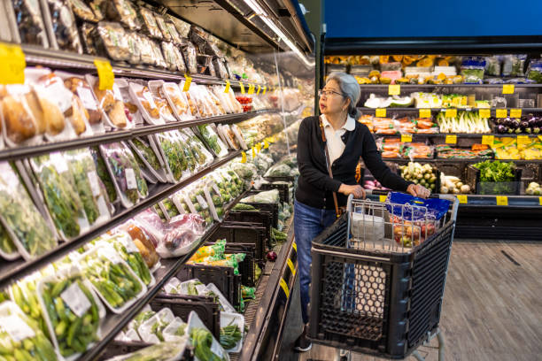 istock Senior Shopping at Grocery Store 1696426638