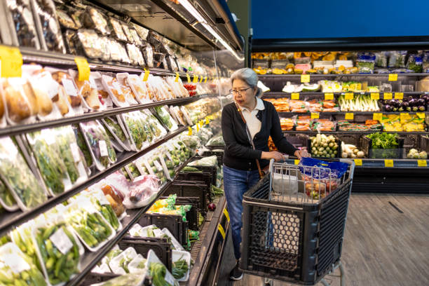 istock Senior Shopping at Grocery Store 1696426644