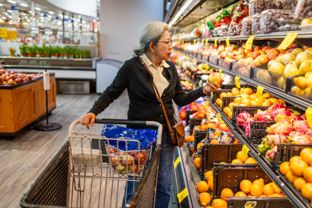 istock Senior Shopping at Grocery Store 1696426646