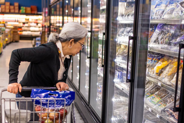 istock Senior Shopping at Grocery Store 1696450351