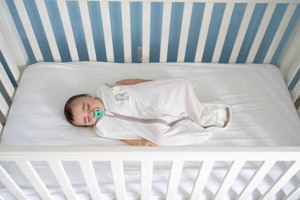 Baby sleeping in a safe crib