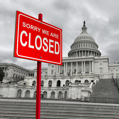US government shutdown and american federal shut down due to spending bill disagreement as a United States national finance symbol as lawmakers disagree on federal funding with 3D illustration elements.