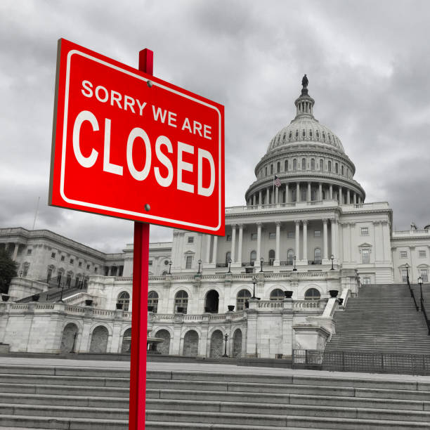 US Government Shutdown US government shutdown and american federal shut down due to spending bill disagreement as a United States national finance symbol as lawmakers disagree on federal funding with 3D illustration elements. government-shutdown stock pictures, royalty-free photos & images