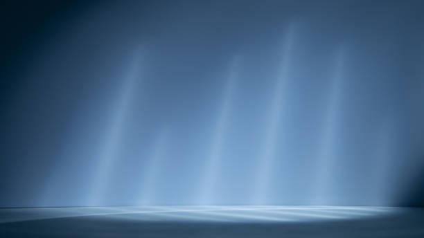 istock Empty light blue background for product presentation with lights and shadows on the wall and floor 1696487094