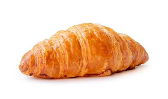 Front view of single croissant is isolated on white background with clipping path.